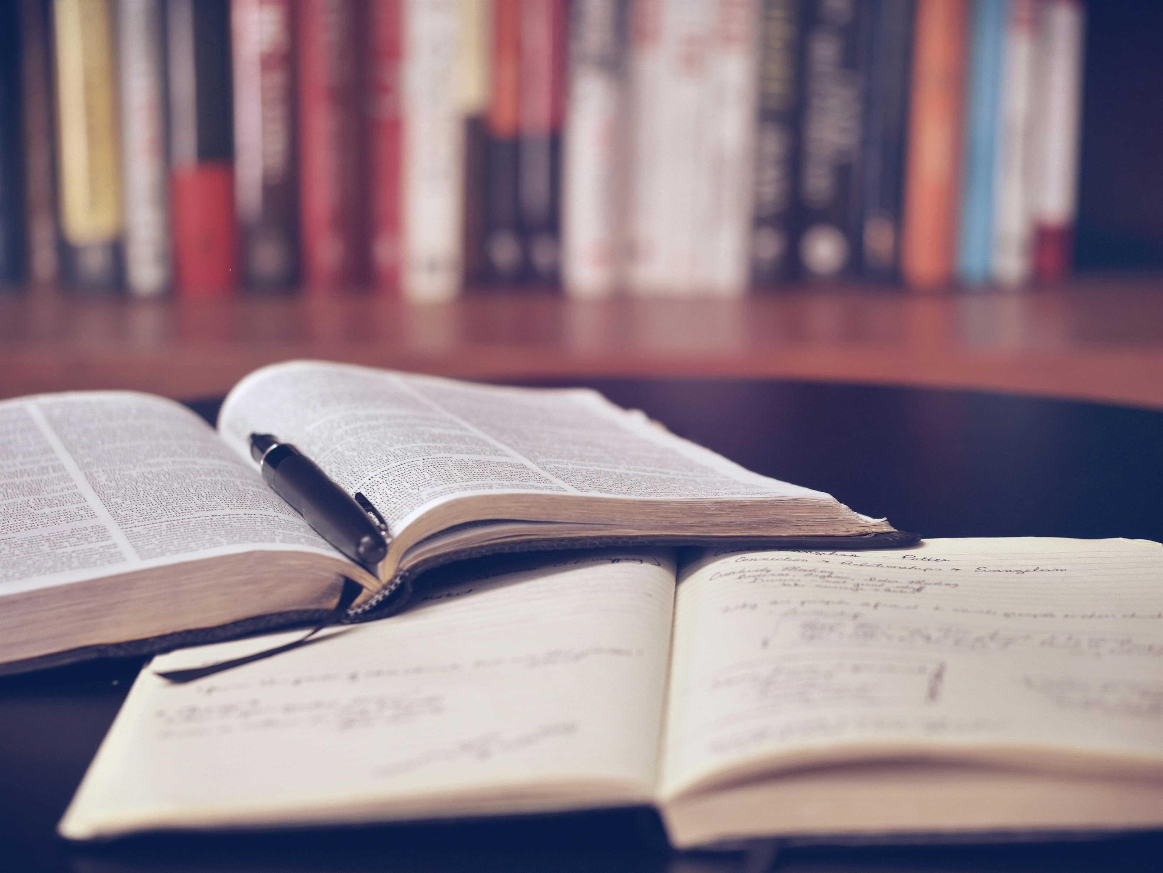 Open Bible and journal on a desk